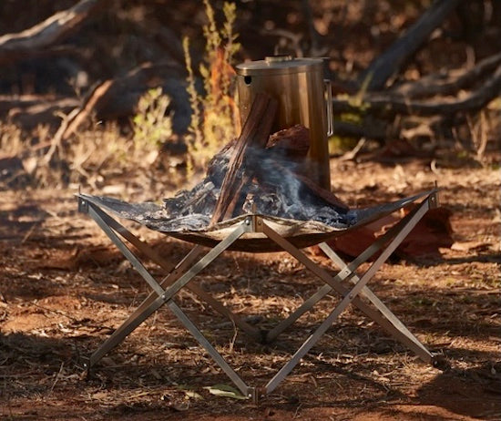 Red Roads Riser, scissor arm collapsible firepit. Comes with the stainless steel mesh  and nylon bag. Also doubles as a stand for the Red Roads Blaze n BBQ Firepit, to increase height.